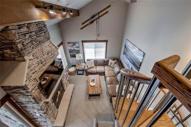 107 Ski Watch Rd Unit 432, Breckenridge, CO 80424 - living area with carpet floors, stairs, track lighting, and a towering ceiling