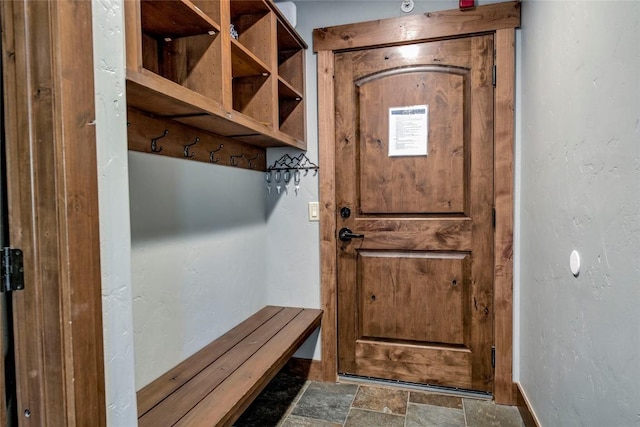 107 Ski Watch Rd Unit 432, Breckenridge, CO 80424 - mudroom featuring stone finish flooring and baseboards