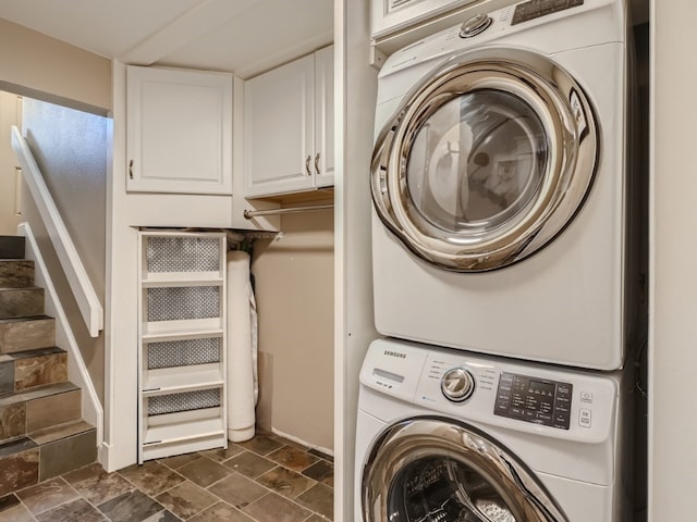 111 Corinthian Cir Unit A, Dillon, CO 80435 - washroom featuring stacked washer / drying machine and dark stone finish floors