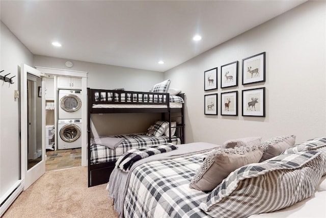 111 Corinthian Cir Unit A, Dillon, CO 80435 - bedroom featuring estacked washer and dryer, baseboard heating, recessed lighting, light stone finish floors, and light carpet