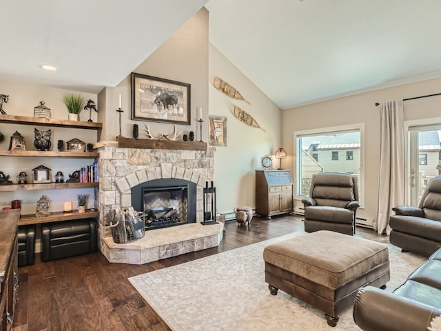 111 Corinthian Cir Unit A, Dillon, CO 80435 - living room with vaulted ceiling, baseboard heating, dark wood finished floors, and a fireplace