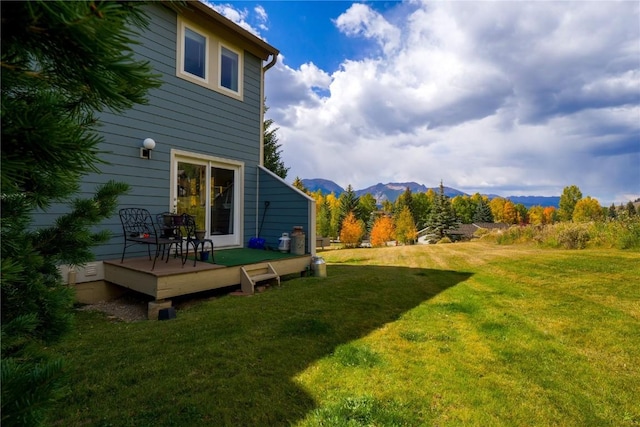 111 Corinthian Cir Unit A, Dillon, CO 80435 - view of green lawn featuring a deck with mountain view