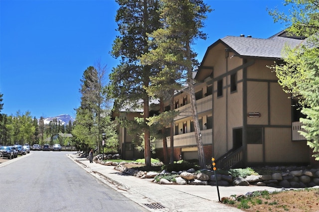311 S High St Unit 108, Breckenridge, CO 80424 - view of asphalt street with sidewalks, a mountain view, and curbs