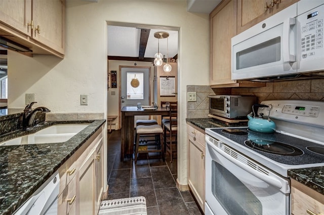 311 S High St Unit 108, Breckenridge, CO 80424 - kitchen with white appliances, a sink, beam ceiling, decorative backsplash, and dark tile patterned flooring