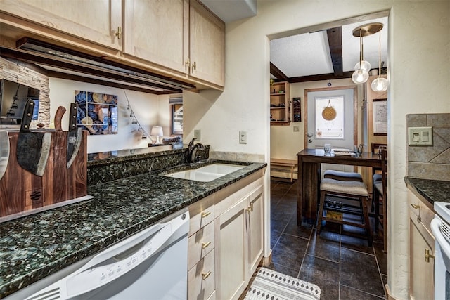 311 S High St Unit 108, Breckenridge, CO 80424 - kitchen with a sink, dishwasher, dark stone counters, and dark tile patterned flooring