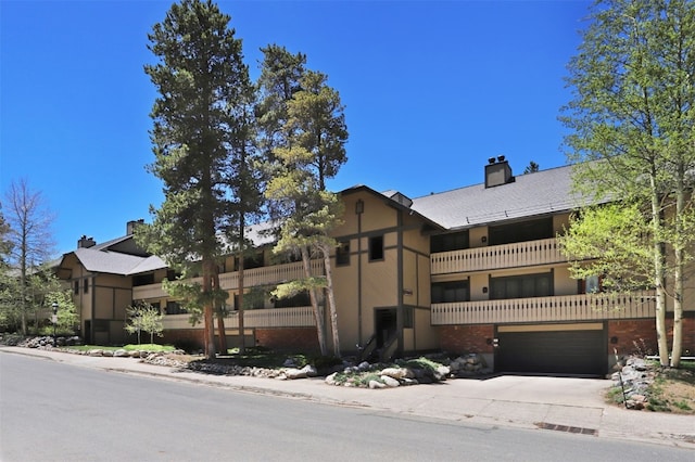 311 S High St Unit 108, Breckenridge, CO 80424 - view of property with a garage and concrete driveway