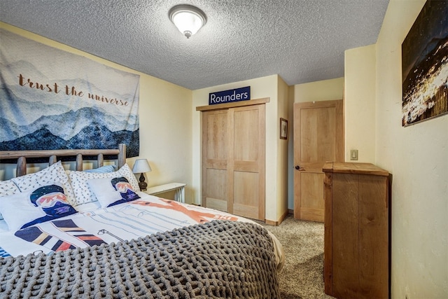 311 S High St Unit 108, Breckenridge, CO 80424 - bedroom with carpet flooring, a textured ceiling, and a closet