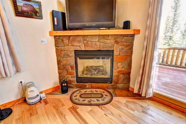 103 War Pony Way, Como, CO 80432 - detailed view of wood finished floors, baseboards, and a fireplace
