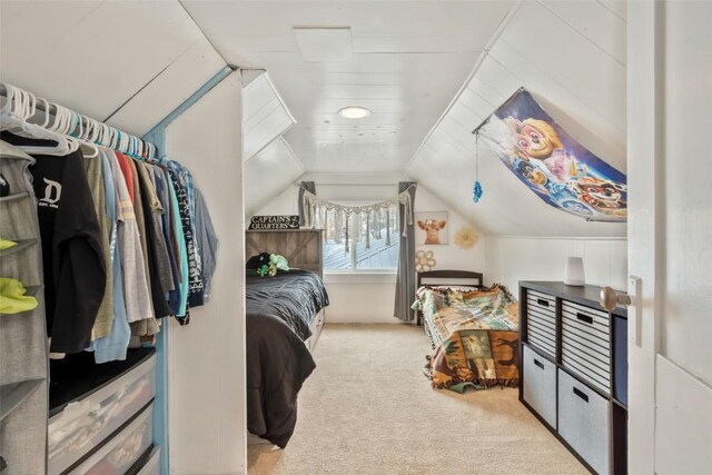 609 E Jefferson Ave, Hayden, CO 81639 - bedroom featuring light carpet, lofted ceiling, and wood walls