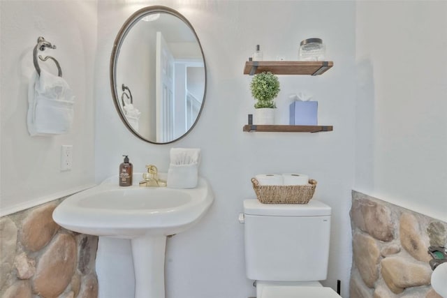 half bath featuring toilet