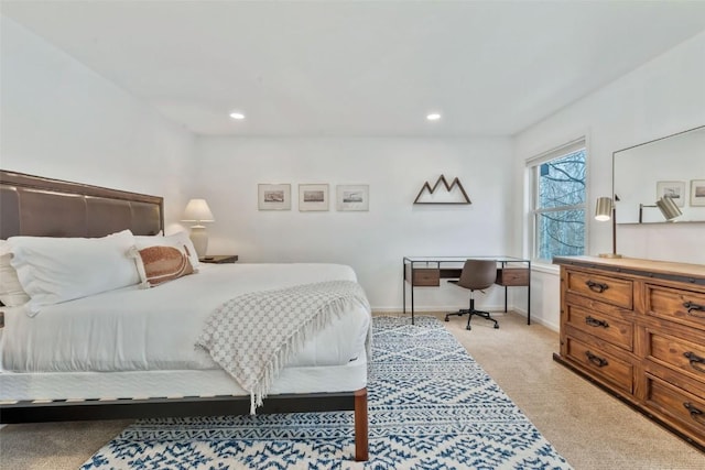 bedroom with baseboards, recessed lighting, and light colored carpet