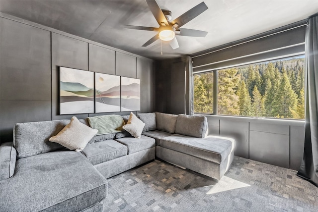 living area with ceiling fan