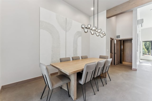 dining area featuring beamed ceiling, baseboards, a high ceiling, and finished concrete flooring