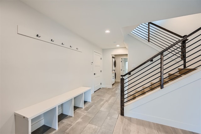 234 Frisco Aly Unit D, Frisco, CO 80443 - mudroom with stacked washer / drying machine, baseboards, and recessed lighting