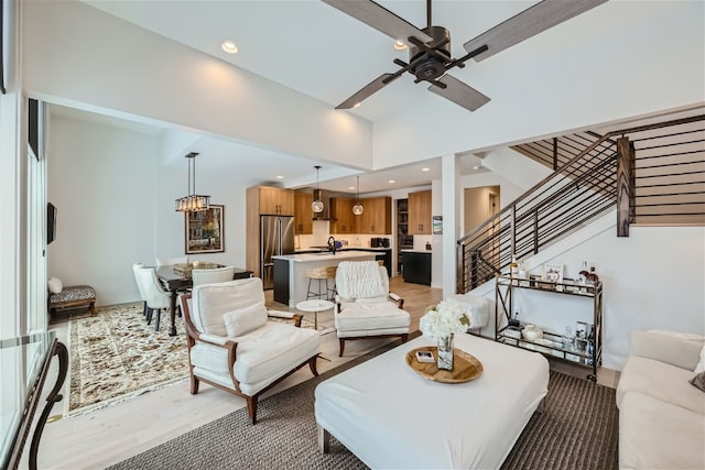 234 Frisco Aly Unit D, Frisco, CO 80443 - living area with a high ceiling, recessed lighting, a ceiling fan, and stairway
