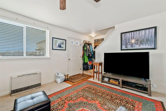 256 Harvest Dr Unit 256, Hayden, CO 81639 - carpeted living area featuring baseboards, a ceiling fan, and heating unit