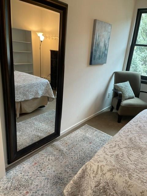 bedroom featuring baseboards