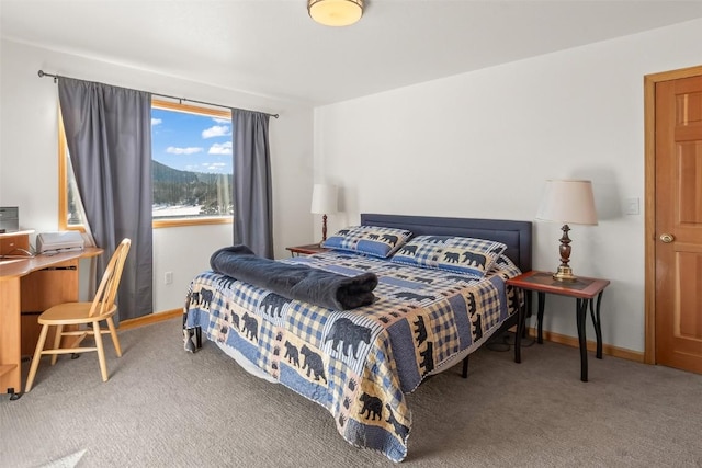 bedroom with baseboards and carpet flooring