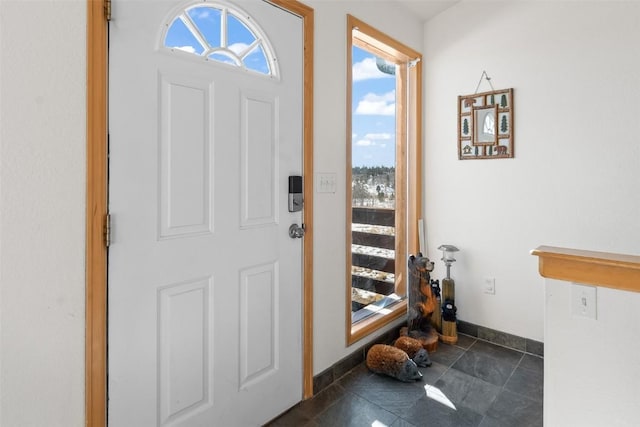 foyer entrance with baseboards