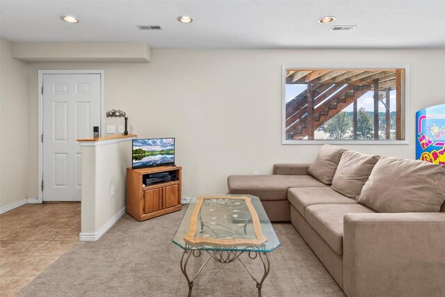 living area featuring recessed lighting and visible vents