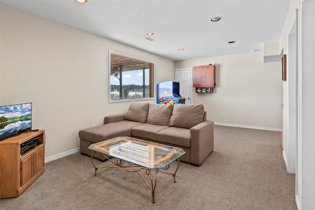 living area with recessed lighting, baseboards, and light carpet