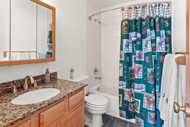 bathroom featuring shower / bath combo, toilet, vanity, and tile patterned floors