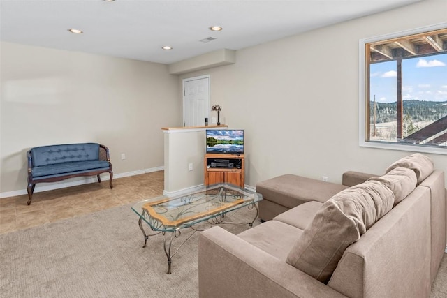 living area featuring baseboards, recessed lighting, and light tile patterned floors
