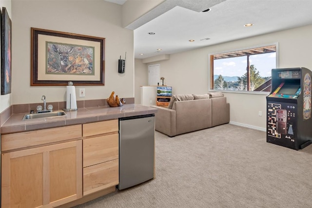interior space featuring light colored carpet, baseboards, and recessed lighting