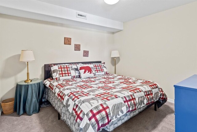 carpeted bedroom with visible vents