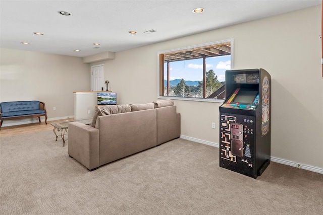 carpeted living room featuring recessed lighting, visible vents, and baseboards