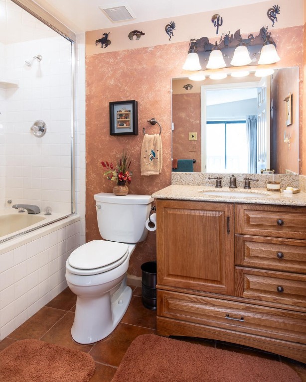 576 Tenderfoot St Unit 163, Dillon, CO 80435 - full bathroom featuring tiled shower / bath, toilet, tile patterned floors, and vanity