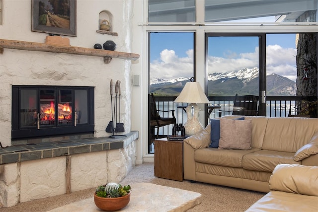 576 Tenderfoot St Unit 163, Dillon, CO 80435 - carpeted living area with a mountain view, a high end fireplace, and plenty of natural light