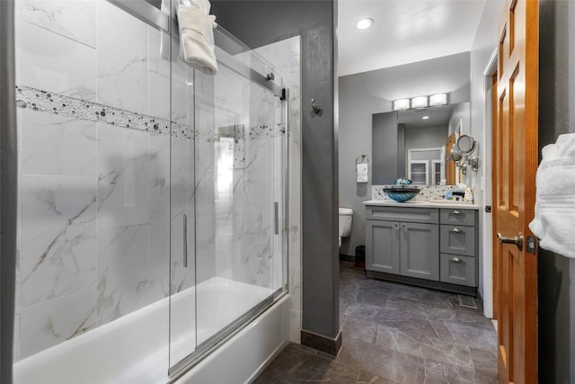 full bathroom featuring marble finish floor, enclosed tub / shower combo, toilet, vanity, and baseboards
