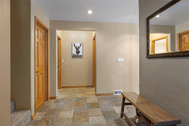 227 Mountain View Dr, Breckenridge, CO 80424 - corridor featuring recessed lighting, stone finish floor, visible vents, and baseboards