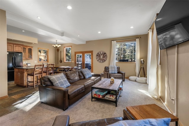 living room featuring a chandelier and recessed lighting