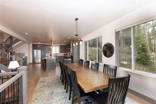 260 N Fuller Placer Rd, Breckenridge, CO 80424 - dining area featuring plenty of natural light, light wood finished floors, recessed lighting, and stairway
