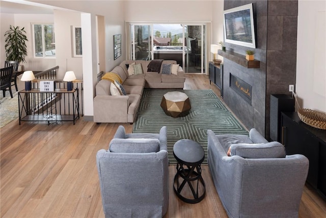 260 N Fuller Placer Rd, Breckenridge, CO 80424 - living room with light wood-style flooring and a tile fireplace