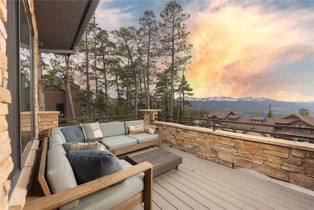 260 N Fuller Placer Rd, Breckenridge, CO 80424 - deck at dusk featuring a mountain view and outdoor lounge area