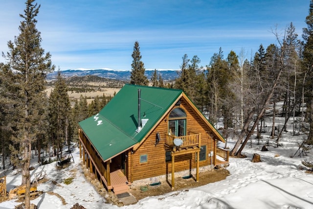 exterior space with a mountain view and metal roof