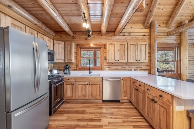 kitchen with wood ceiling, stainless steel appliances, light wood finished floors, and plenty of natural light