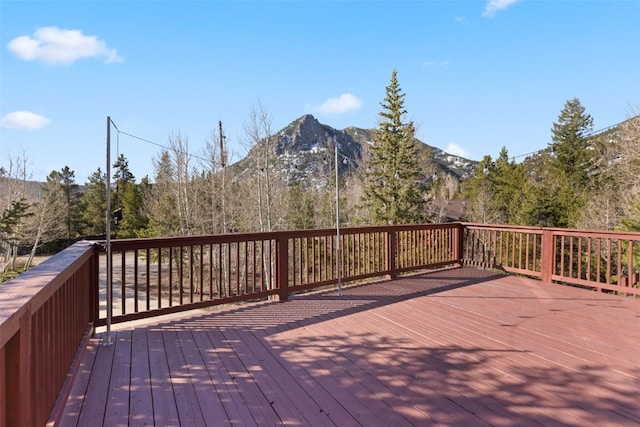 wooden deck featuring a mountain view