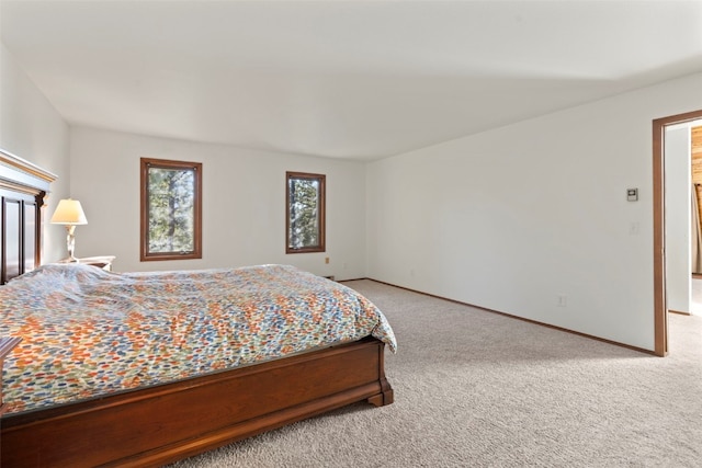 carpeted bedroom with baseboards