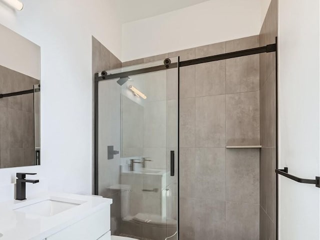 350 Stan Miller Unit 100, Breckenridge, CO 80424 - bathroom with vanity, toilet, and a shower stall