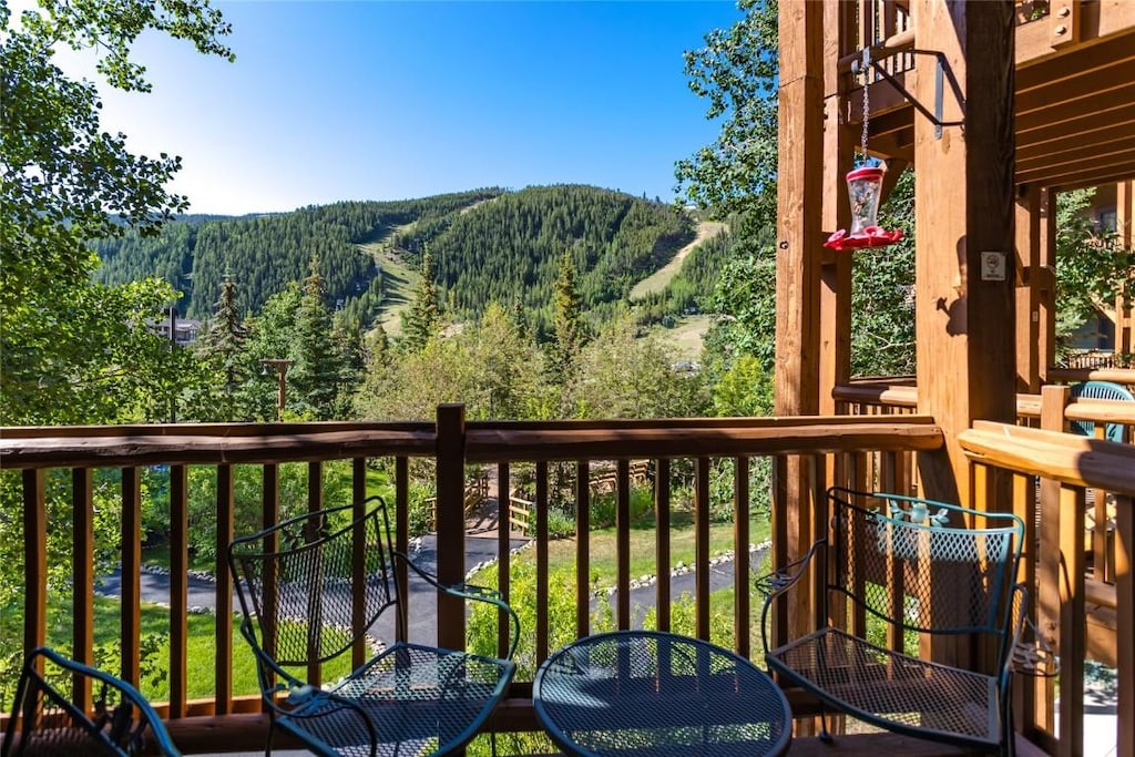 22784 US Highway 6 Unit 2626, Dillon, CO 80435 - balcony with a wooded view and a mountain view