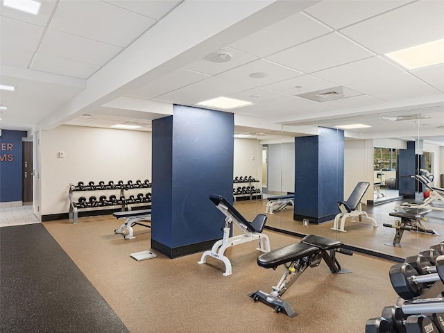 workout area featuring a paneled ceiling