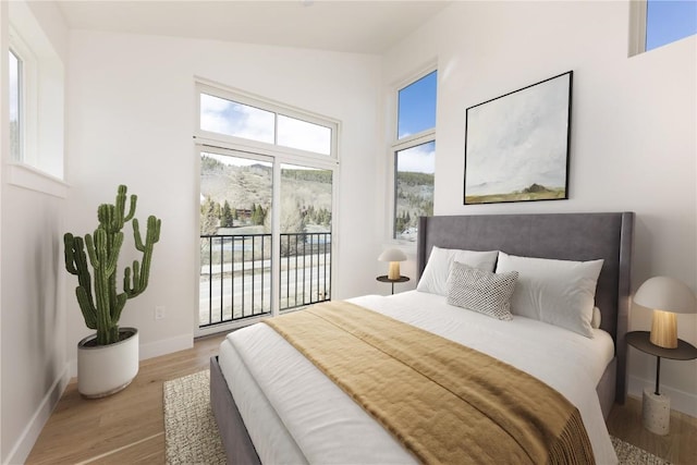 35 Argentine Ct Unit 305, Keystone, CO 80435 - bedroom featuring access to outside and wood finished floors