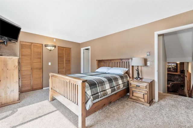 bedroom with light carpet and baseboards