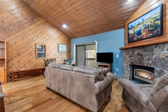 2915 Chinook Ln Unit B22, Steamboat Springs, CO 80487 - living area with lofted ceiling, wooden ceiling, light wood-style floors, a fireplace, and recessed lighting