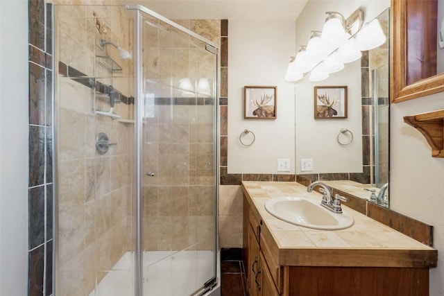 bathroom featuring vanity and a stall shower