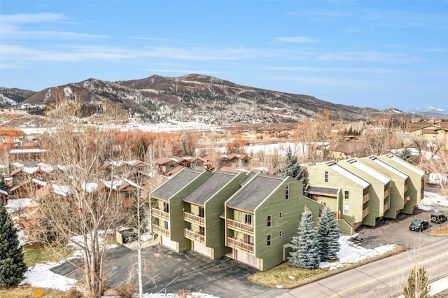 drone / aerial view featuring a residential view and a mountain view